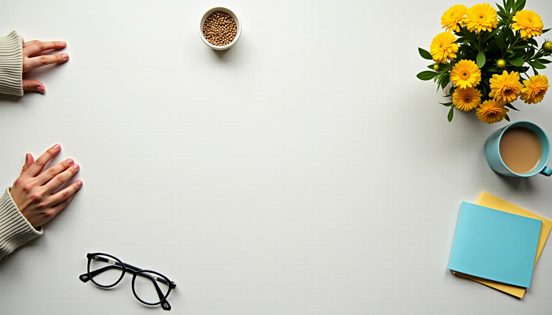 A serene workspace featuring hands, glasses, a cup, flowers, and a free prompts generator nearby.